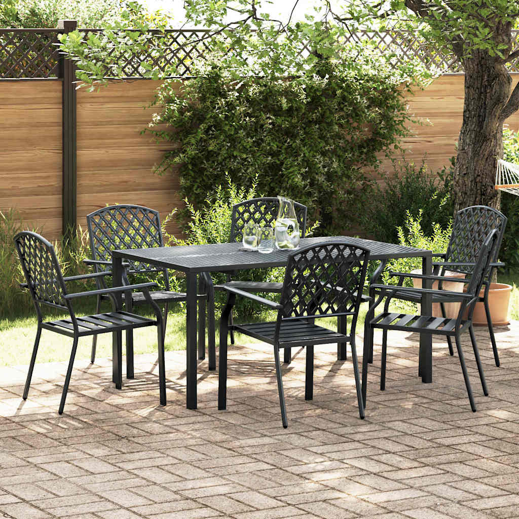 Black steel outdoor dining set with six chairs and a table, side view in a garden setting.