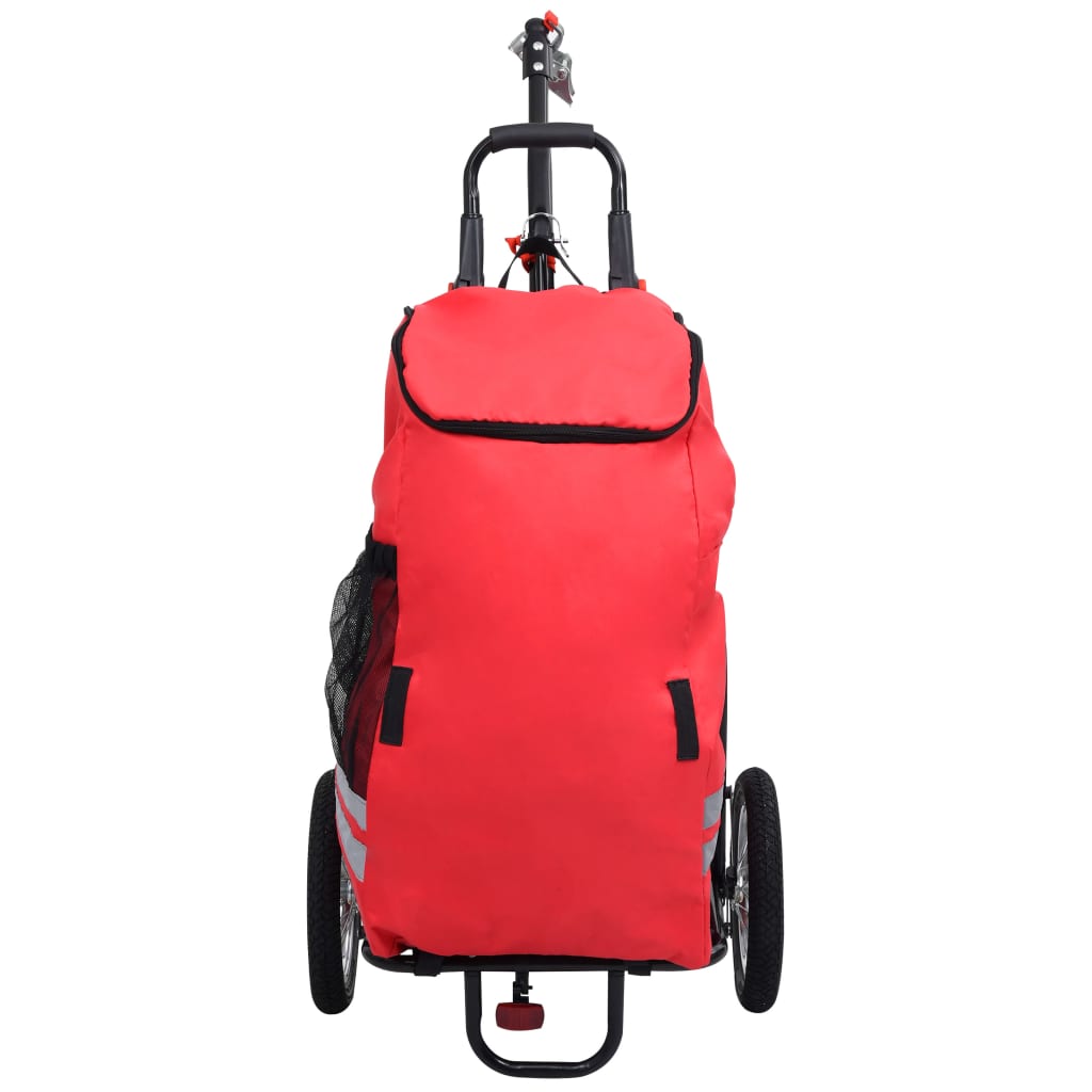 Összecsukható kerékpár-utánfutó piros és fekete táskával 
