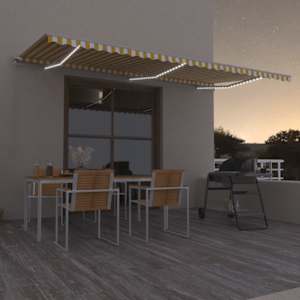 Ručně zatahovací markýza s LED světlem 600 x 300 cm žlutobílá - obrázek 1