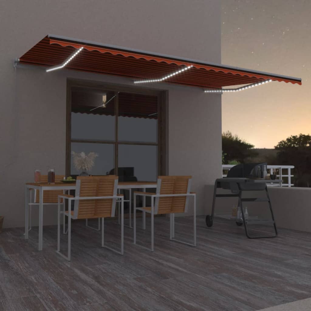 vidaXL Copertină retractabilă manual, LED, portocaliu&maro, 600x300 cm