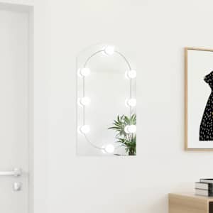 Ogledalo z LED lučkami 70x40 cm stekleno z lokom