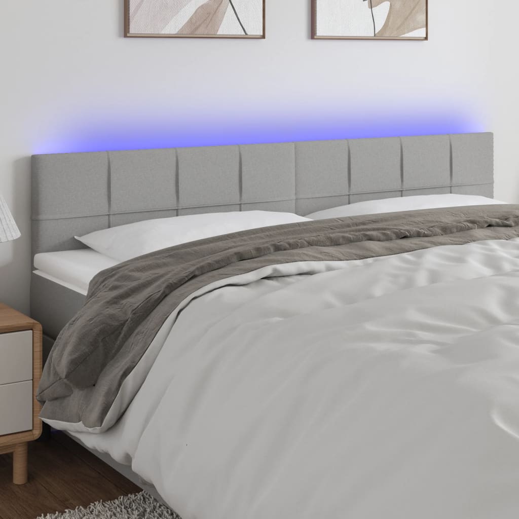  Čelo postele s LED bledosivé 160x5x78/88 cm látka
