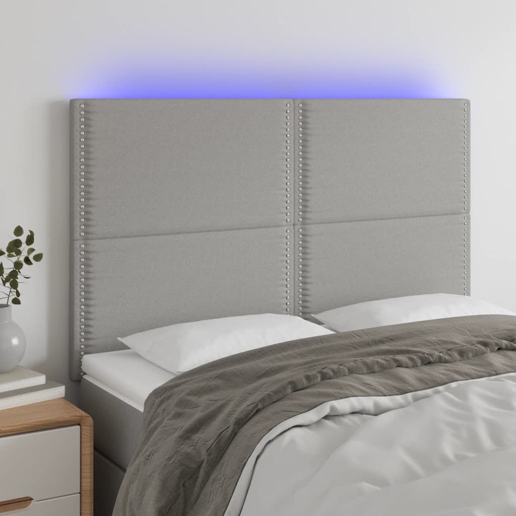 Čelo postele s LED světle šedé 144x5x118/128 cm textil