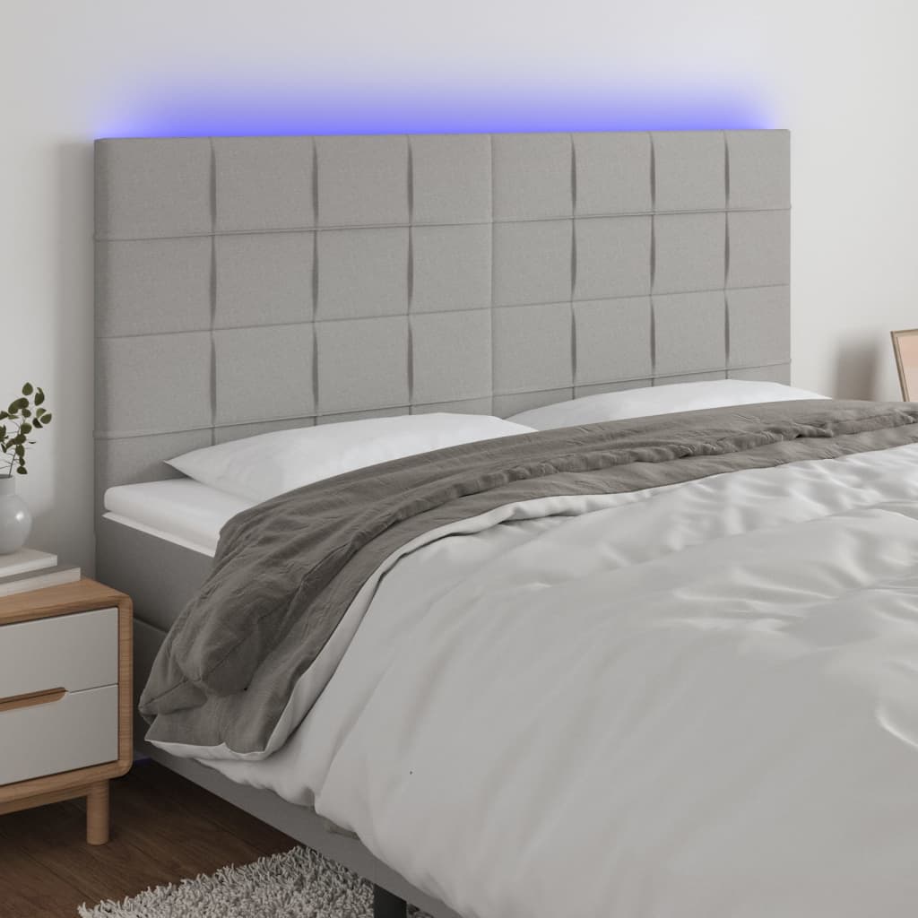 Čelo postele s LED světle šedé 160x5x118/128 cm textil