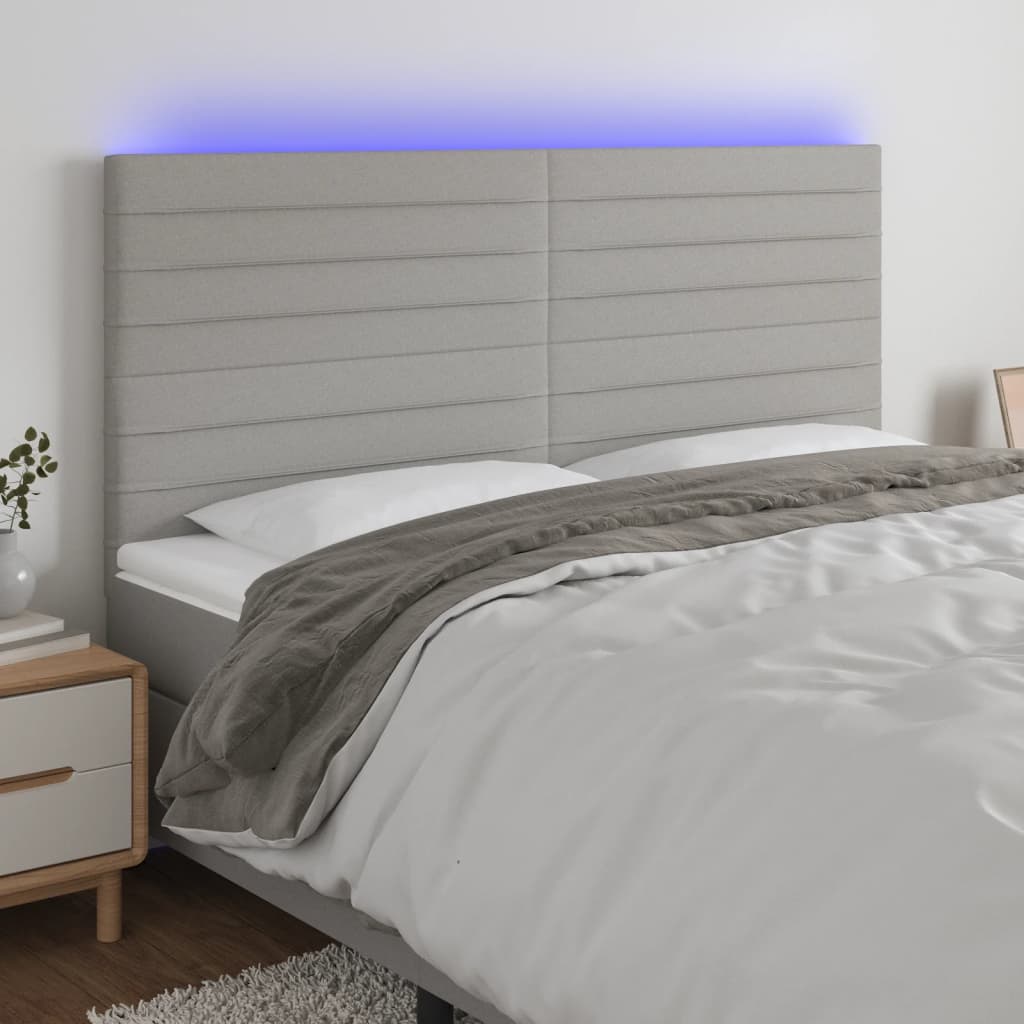 Čelo postele s LED světle šedé 180x5x118/128 cm textil