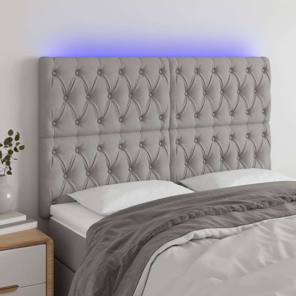 Čelo postele s LED světle šedé 144x7x118/128 cm textil