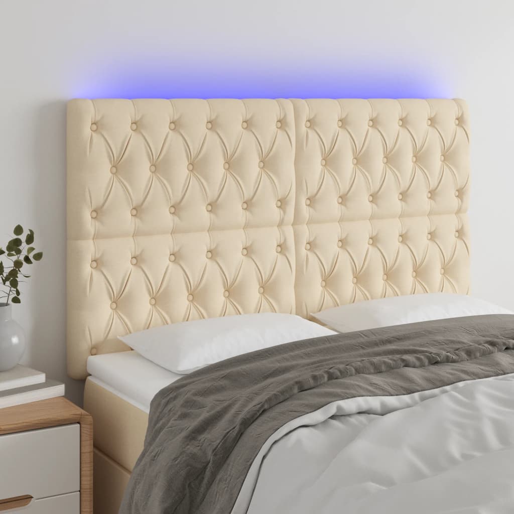 Čelo postele s LED krémové 144x7x118/128 cm textil