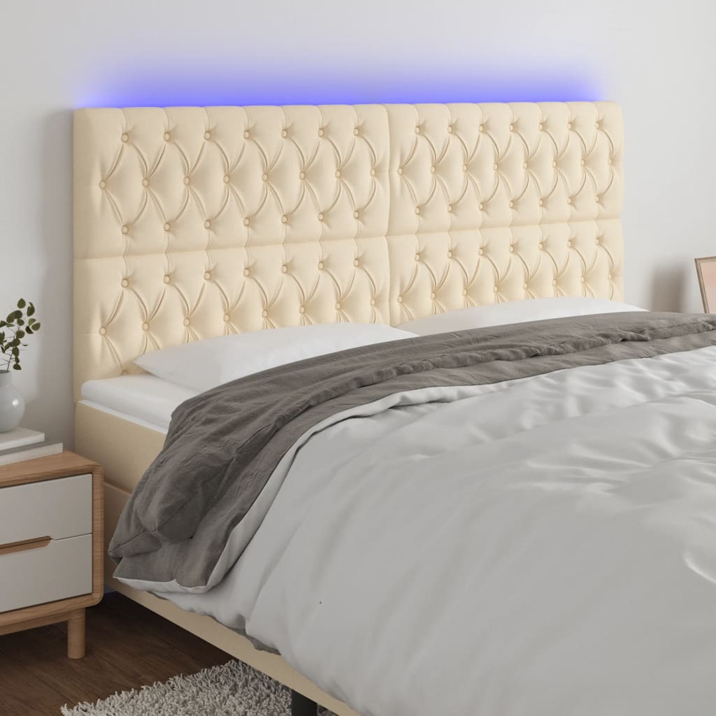 Čelo postele s LED krémové 180x7x118/128 cm textil