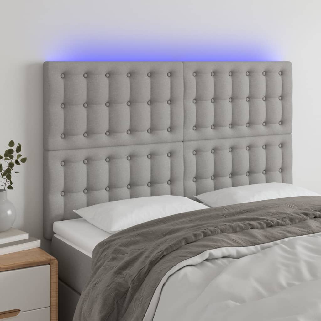 Čelo postele s LED světle šedé 144x5x118/128 cm textil