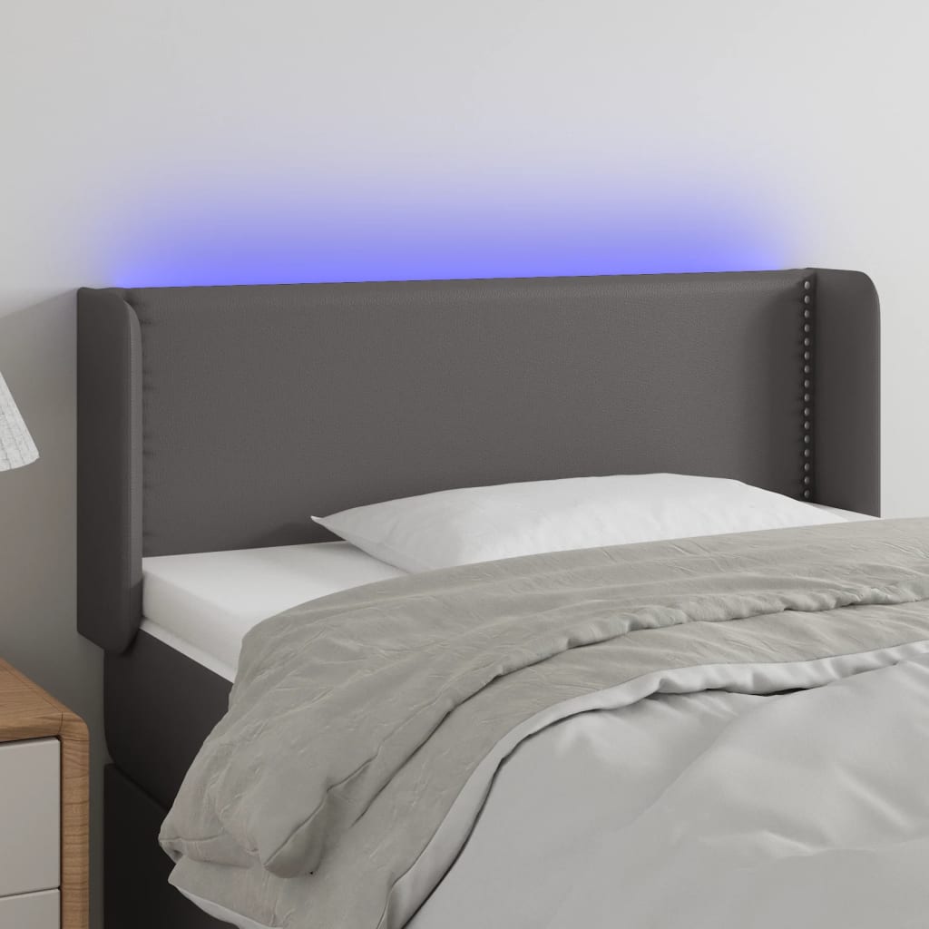 Čelo postele s LED šedé 103 x 16 x 78/88 cm umělá kůže