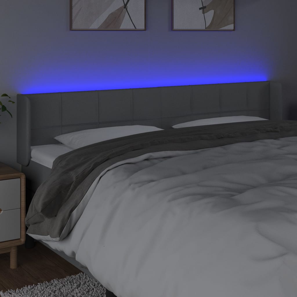  Čelo postele s LED bledosivé 163x16x78/88 cm látka