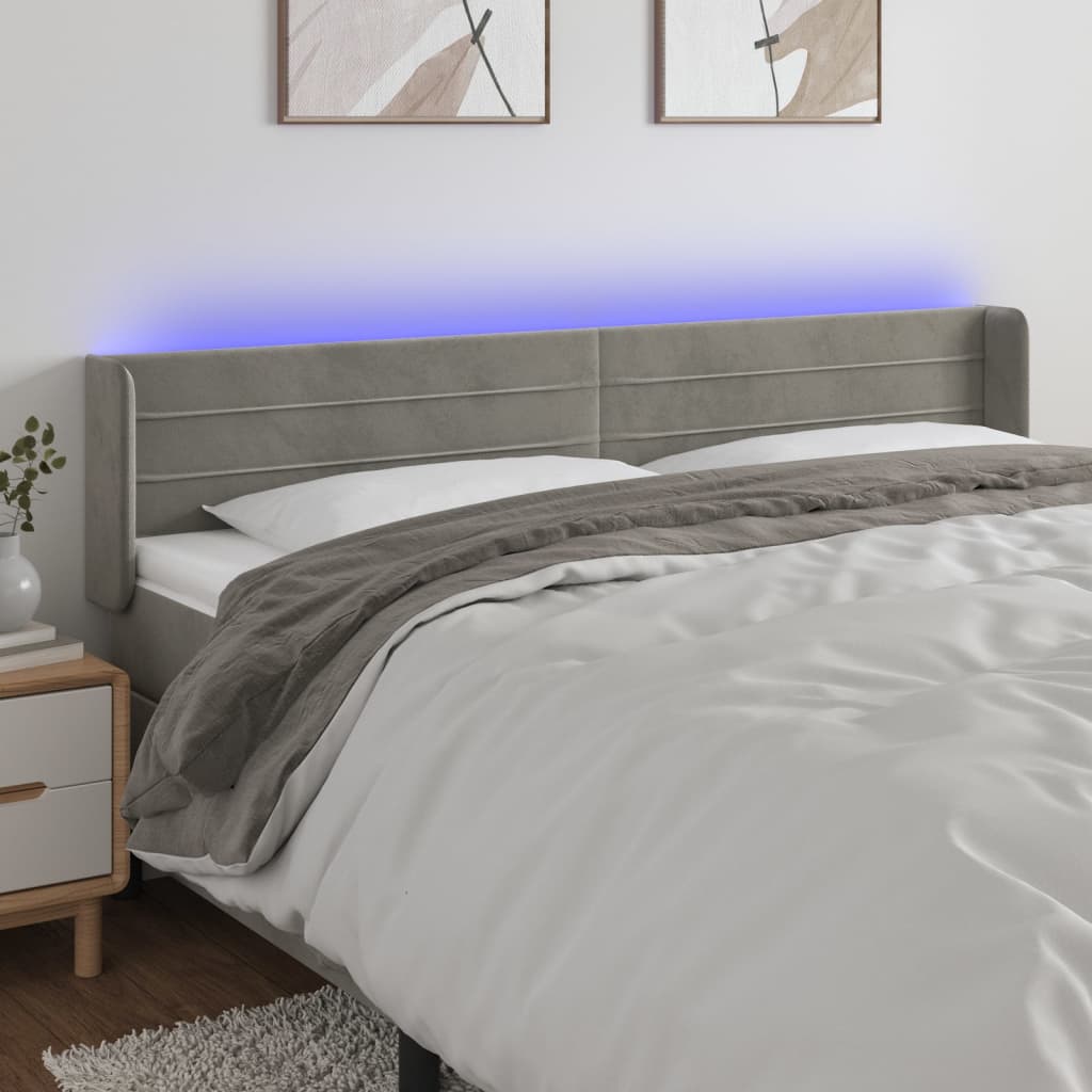 Čelo postele s LED světle šedé 183 x 16 x 78/88 cm samet