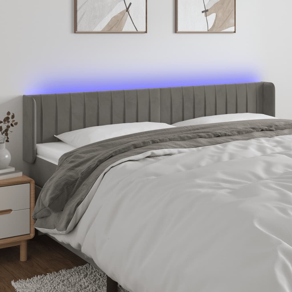 Čelo postele s LED světle šedé 203 x 16 x 78/88 cm samet