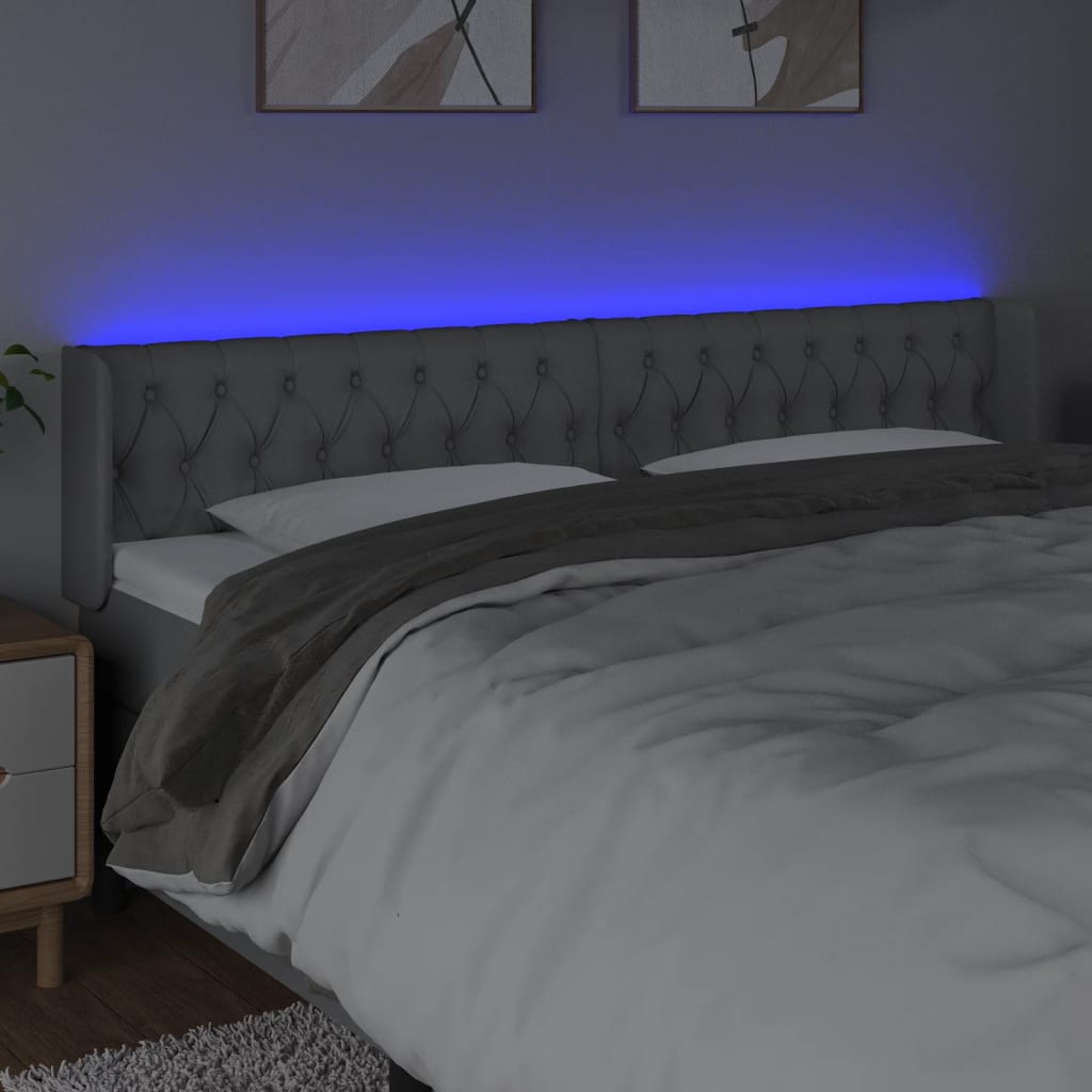  Čelo postele s LED bledosivé 183x16x78/88 cm látka