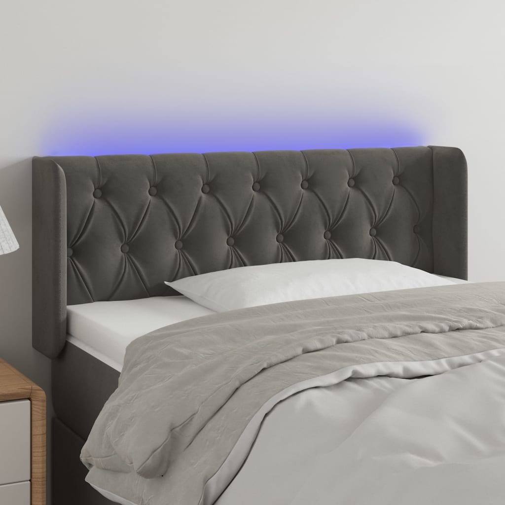 Čelo postele s LED tmavě šedé 103 x 16 x 78/88 cm samet