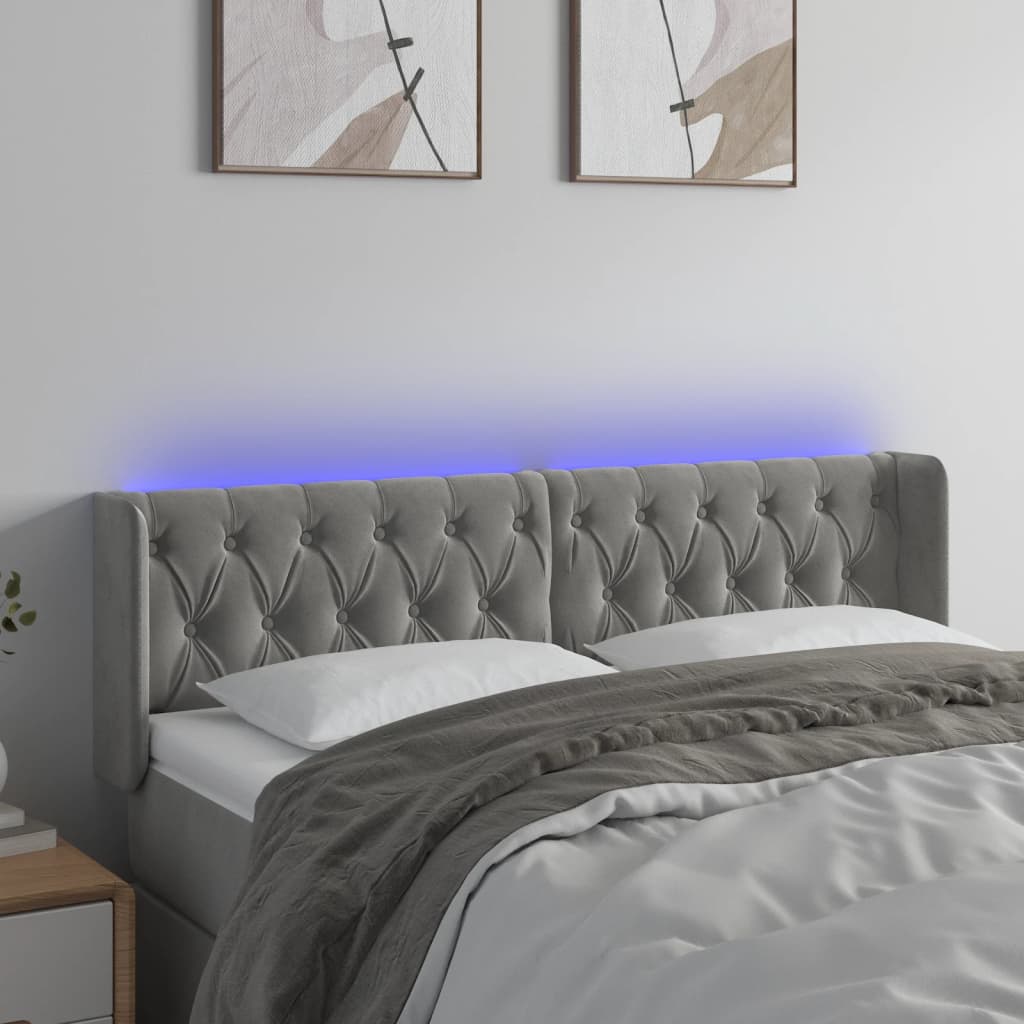 Čelo postele s LED světle šedé 163 x 16 x 78/88 cm samet
