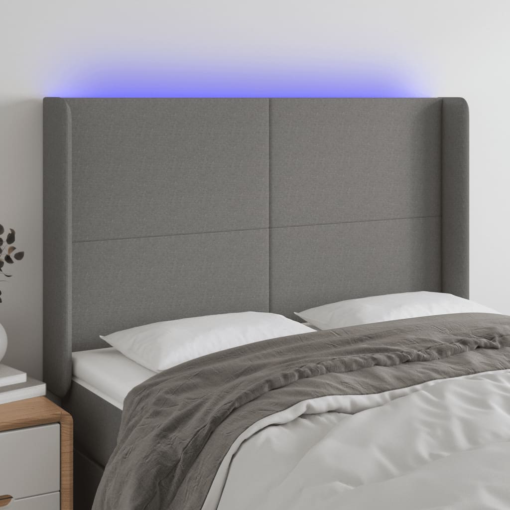 Čelo postele s LED tmavě šedé 147 x 16 x 118/128 cm textil