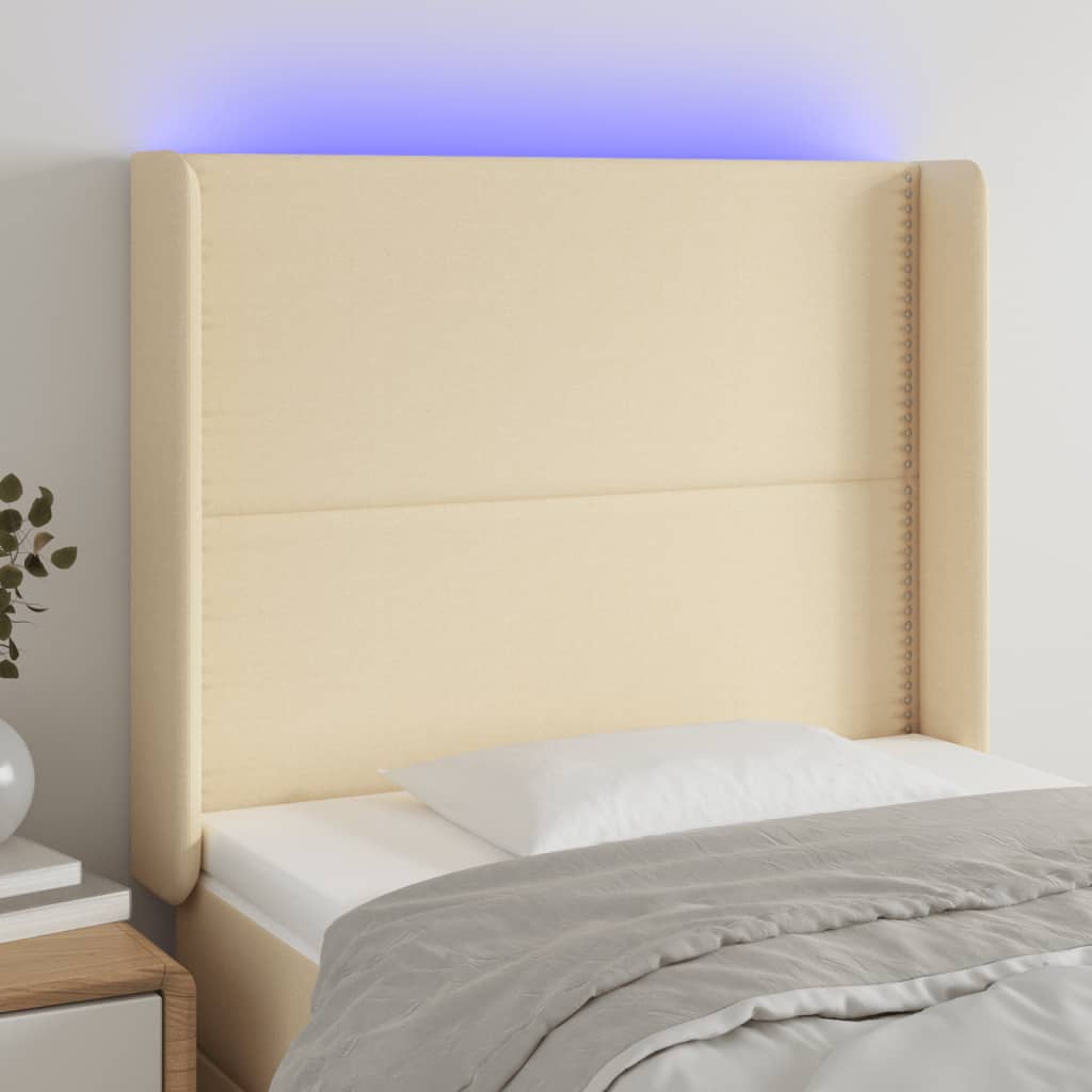 vidaXL sengegavl med LED-lys 83x16x118/128 cm stof cremefarvet