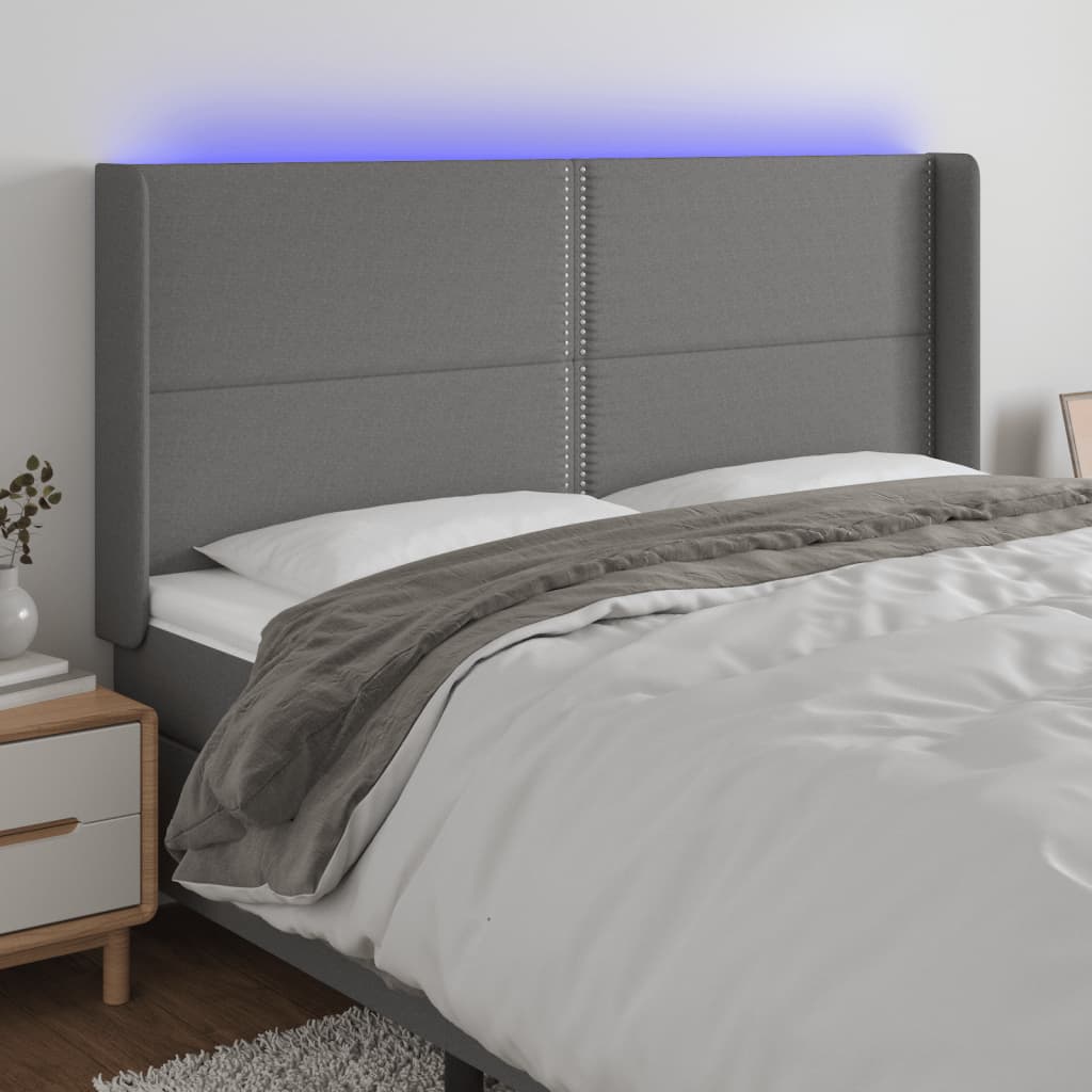 Čelo postele s LED tmavě šedé 203 x 16 x 118/128 cm textil