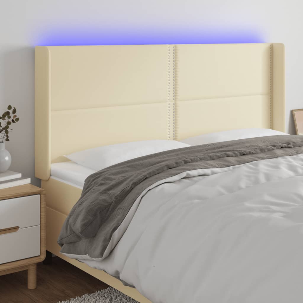 Čelo postele s LED krémové 163 x 16 x 118/128 cm umělá kůže