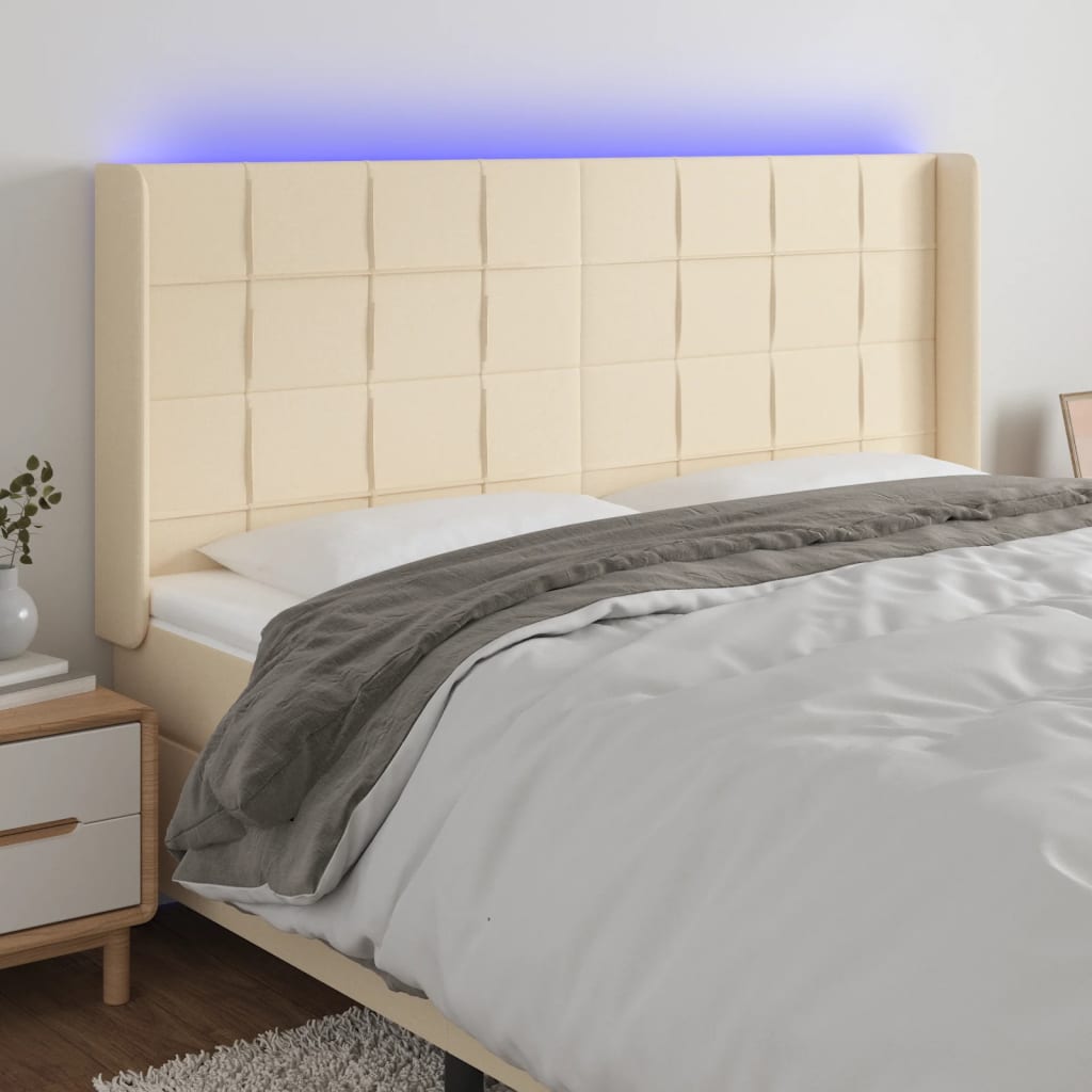 Čelo postele s LED krémové 163 x 16 x 118/128 cm textil