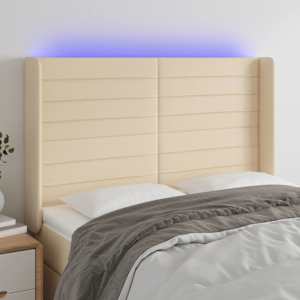 Čelo postele s LED krémové 147 x 16 x 118/128 cm textil - obrázek 1