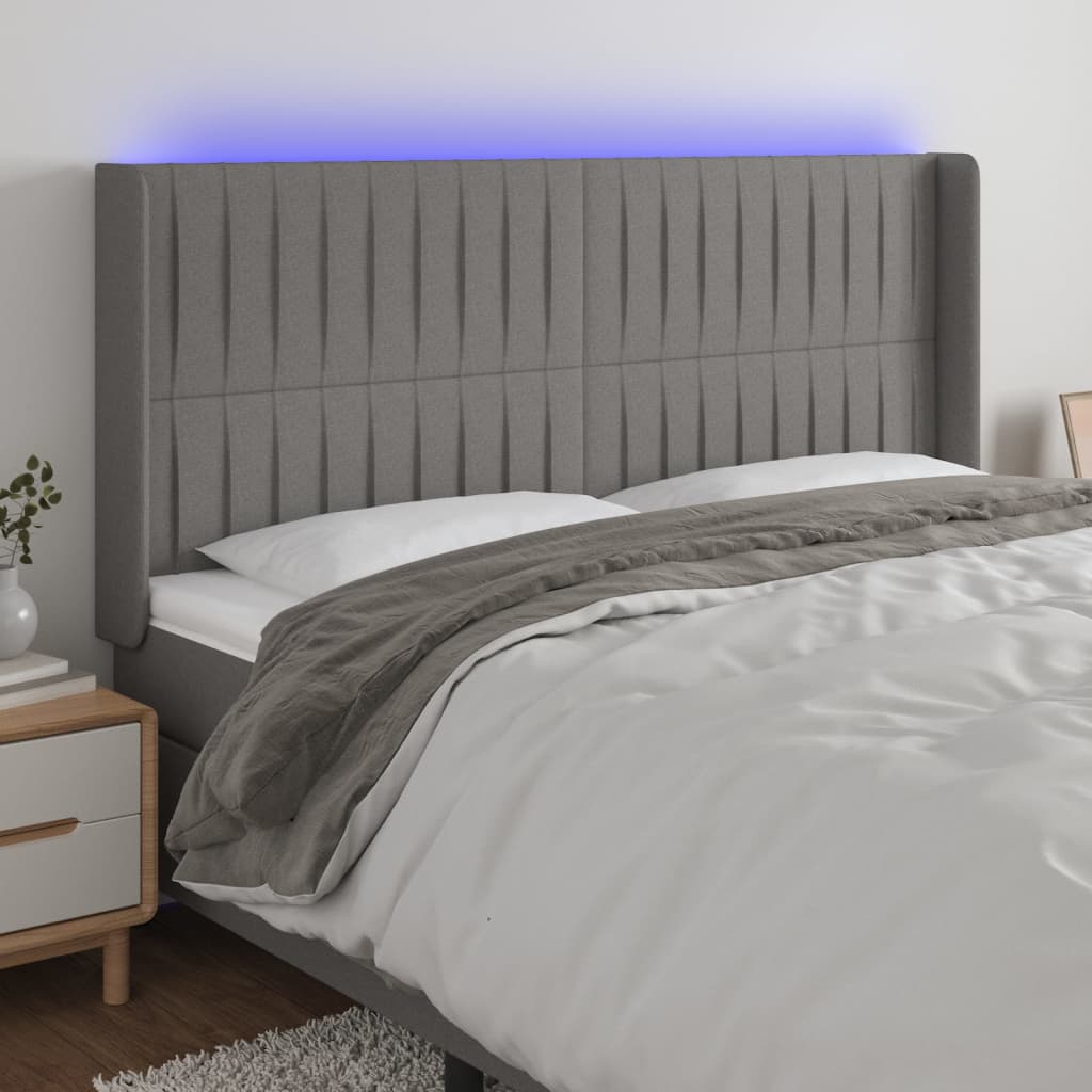 Čelo postele s LED tmavě šedé 183 x 16 x 118/128 cm textil