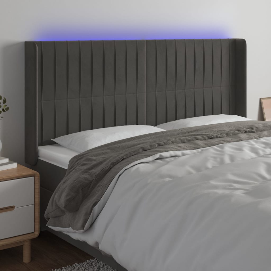 Čelo postele s LED tmavě šedé 163 x 16 x 118/128 cm samet