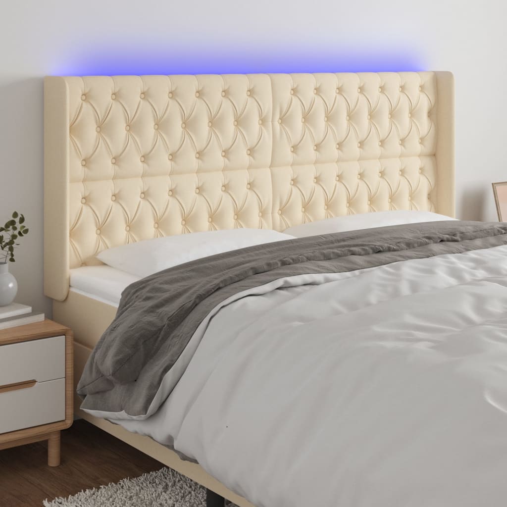 Čelo postele s LED krémové 183 x 16 x 118/128 cm textil