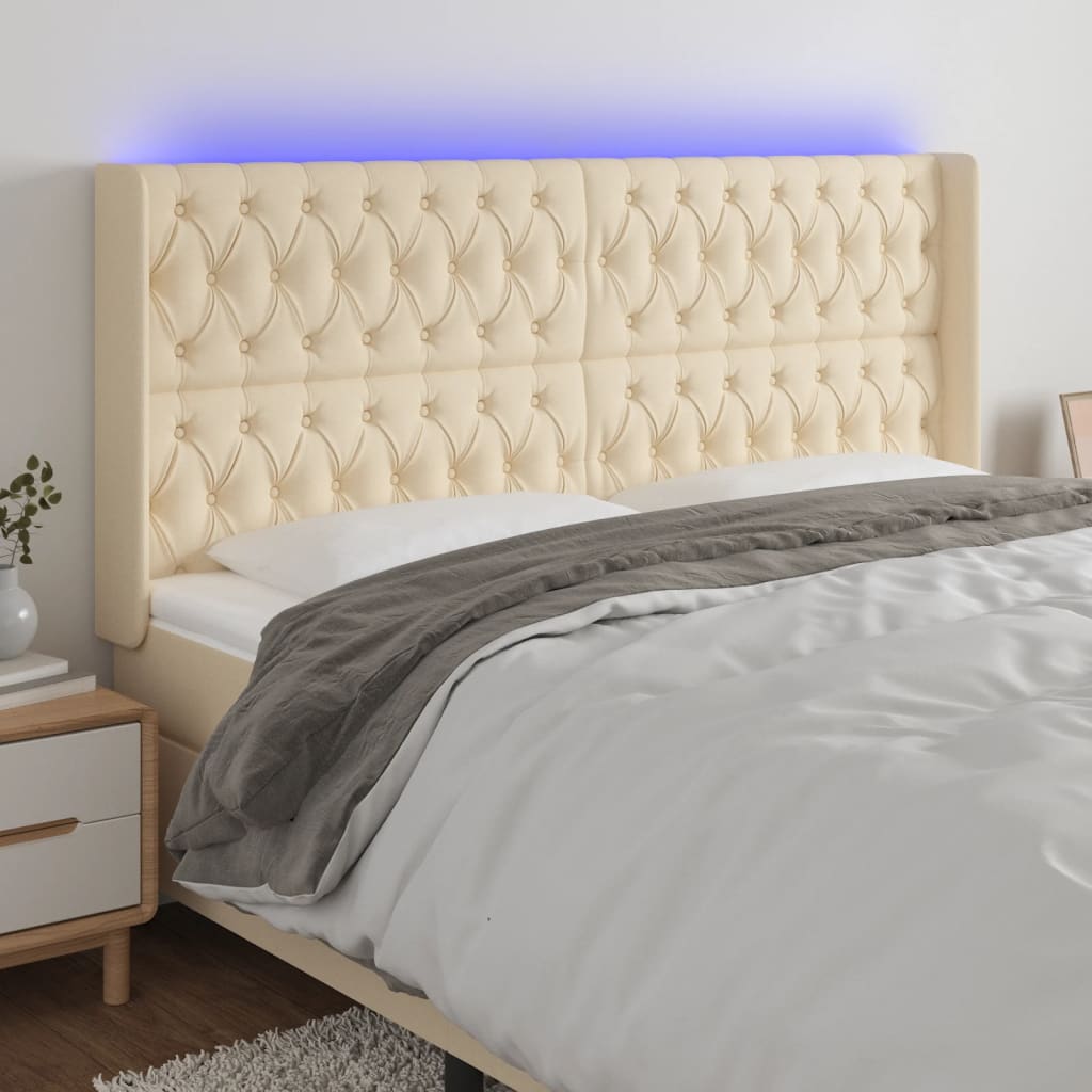 Čelo postele s LED krémové 203 x 16 x 118/128 cm textil