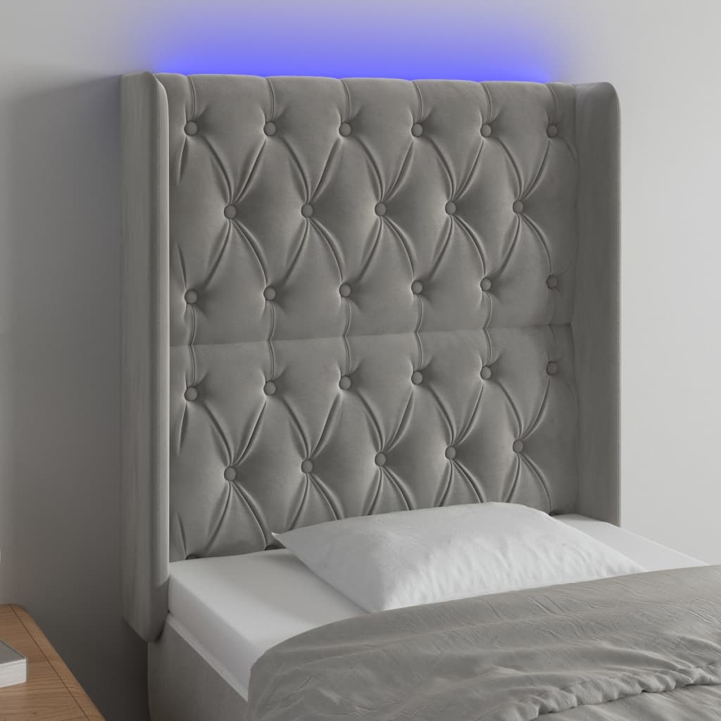 Čelo postele s LED světle šedé 83 x 16 x 118/128 cm samet