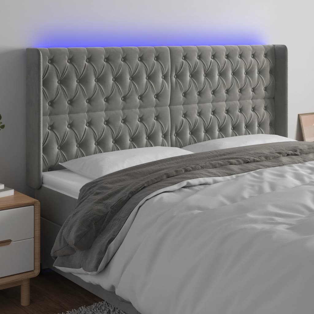 Čelo postele s LED světle šedé 183 x 16 x 118/128 cm samet