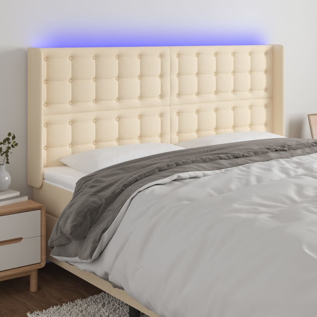Čelo postele s LED krémové 163 x 16 x 118/128 cm textil