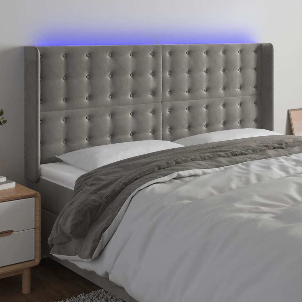 Čelo postele s LED světle šedé 183 x 16 x 118/128 cm samet