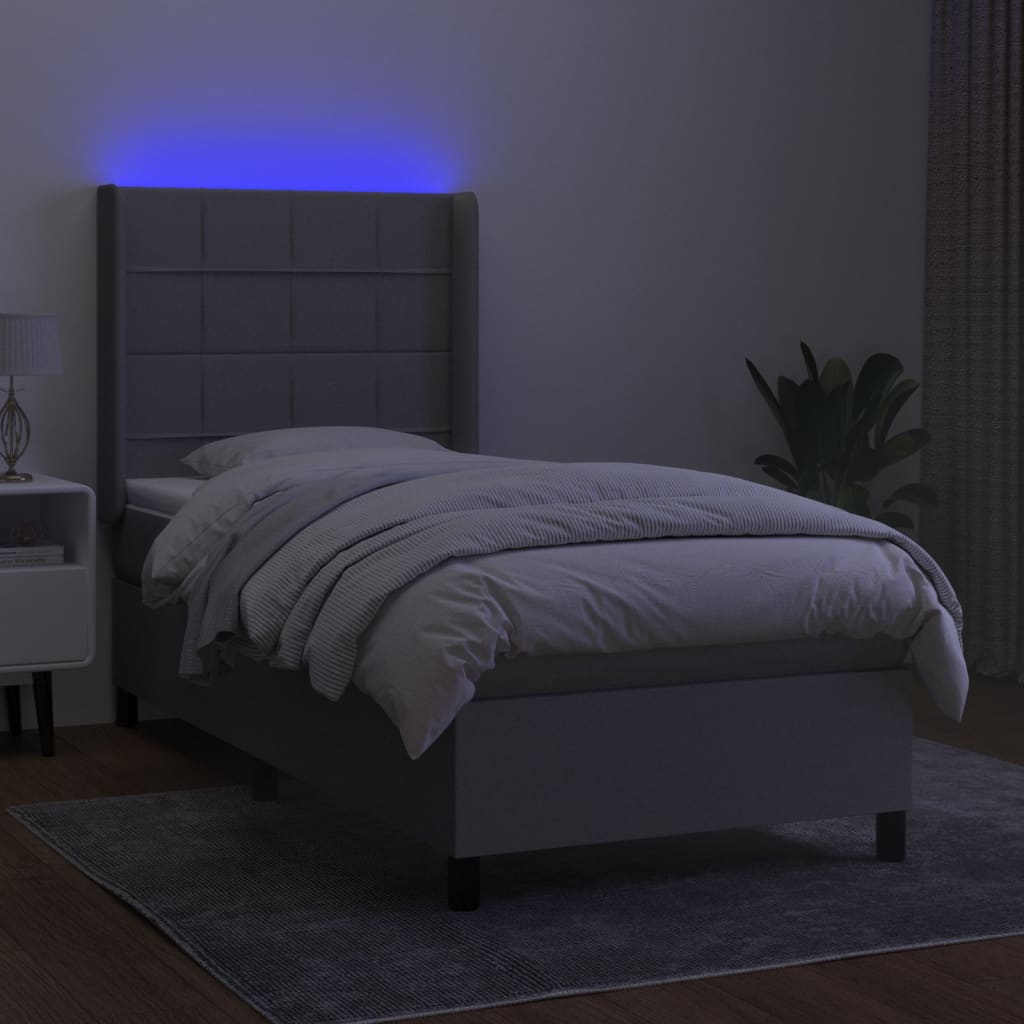 Box spring postel s matrací a LED světle šedá 90x200 cm textil