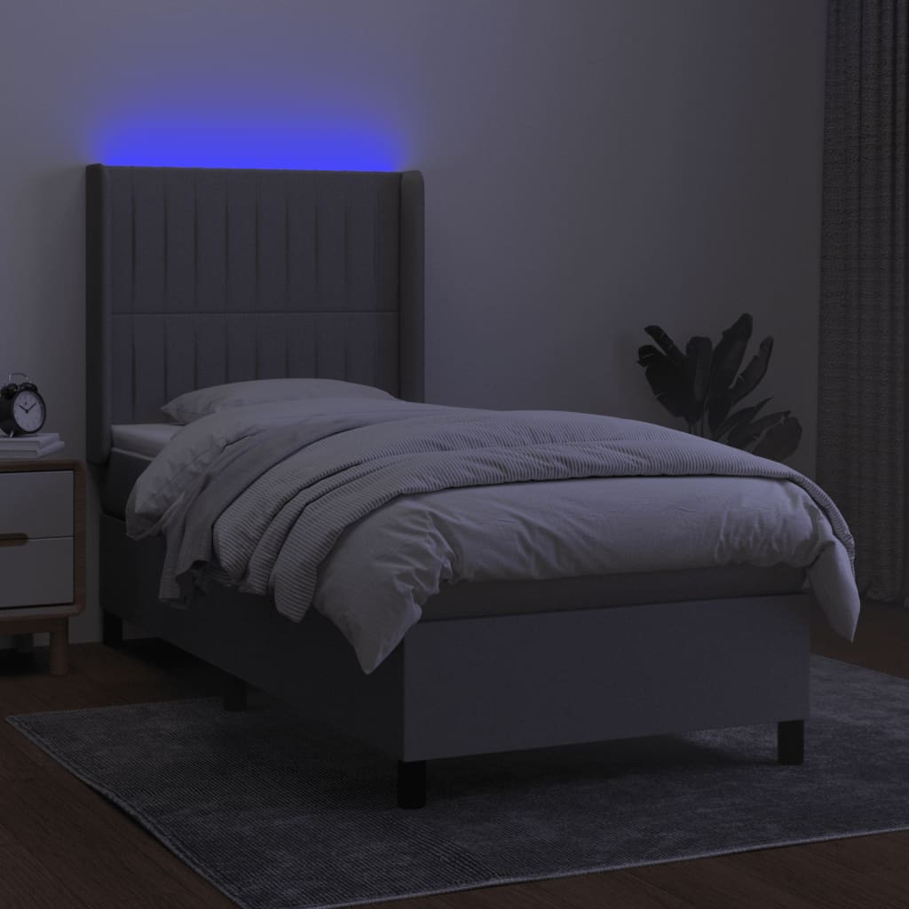 Box spring postel s matrací a LED světle šedá 90x200 cm textil
