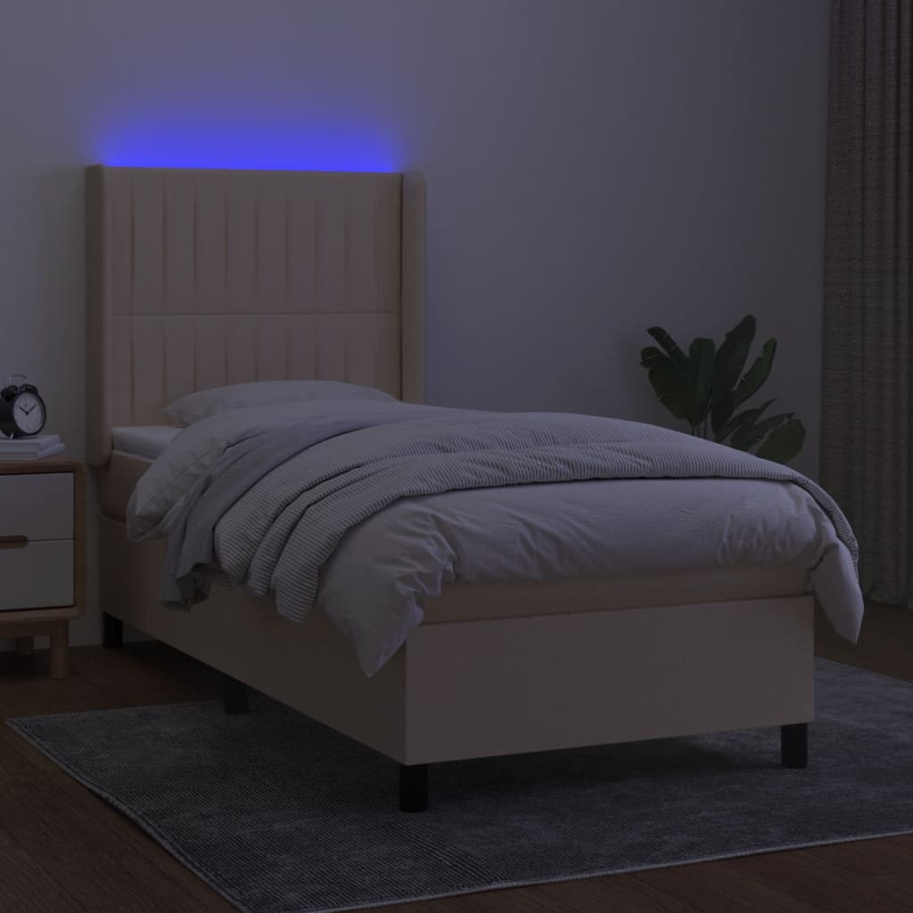 Box spring postel s matrací a LED krémová 90x200 cm textil