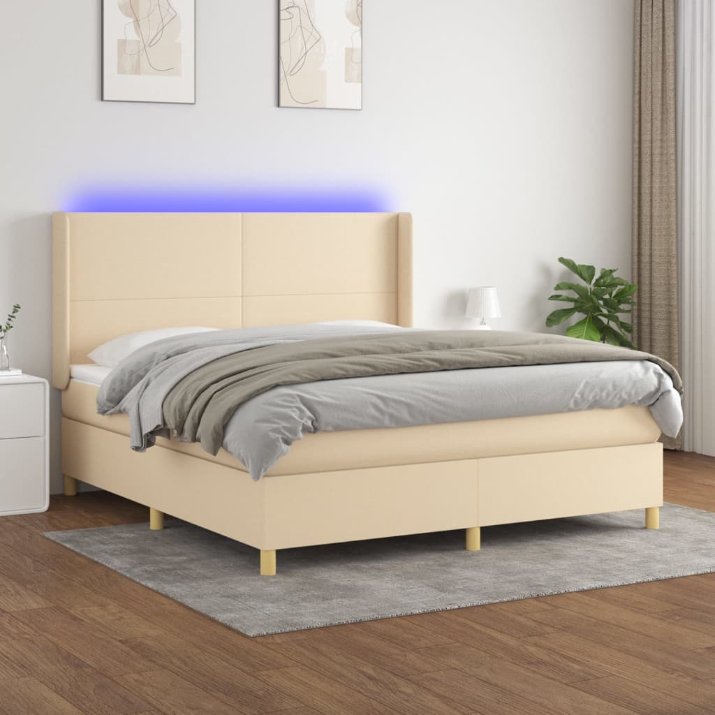 Box spring postel s matrací a LED krémová 180x200 cm textil