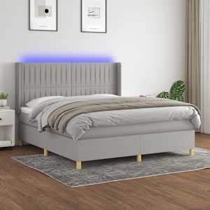 Box spring postelja z vzmetnico LED sv. siva 180x200 cm blago