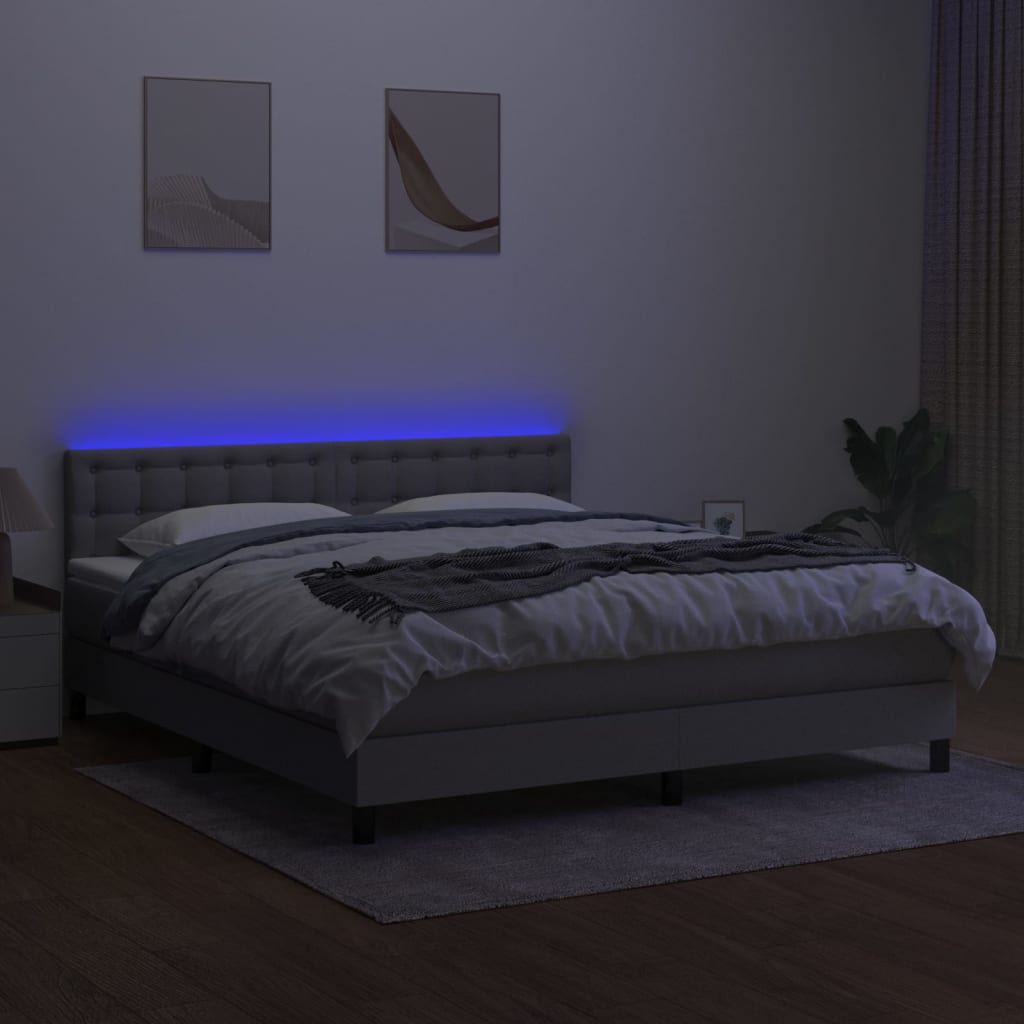 Box spring postelja z vzmetnico LED sv. siva 160x200 cm blago