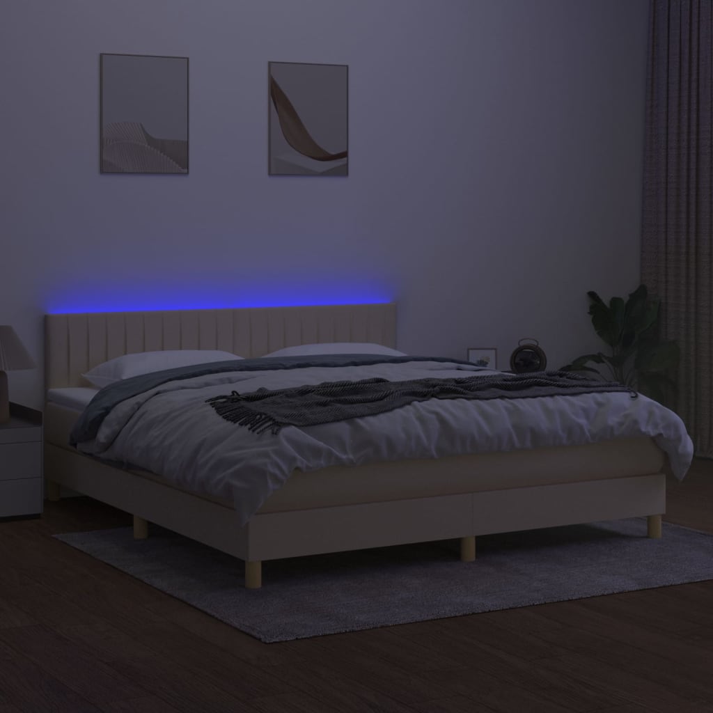 Box spring postel s matrací a LED krémová 180x200 cm textil