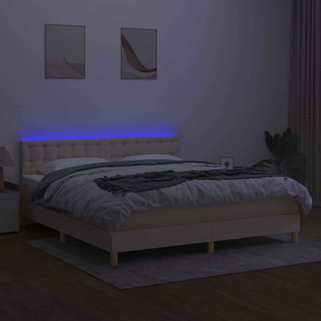 Box spring postel s matrací a LED krémová 180x200 cm textil