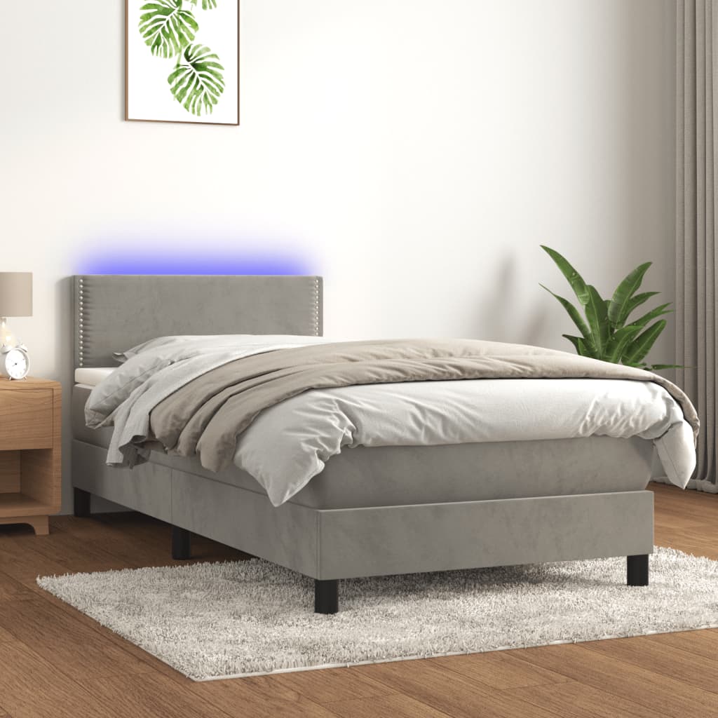Box spring postel s matrací a LED světle šedá 90x200 cm samet
