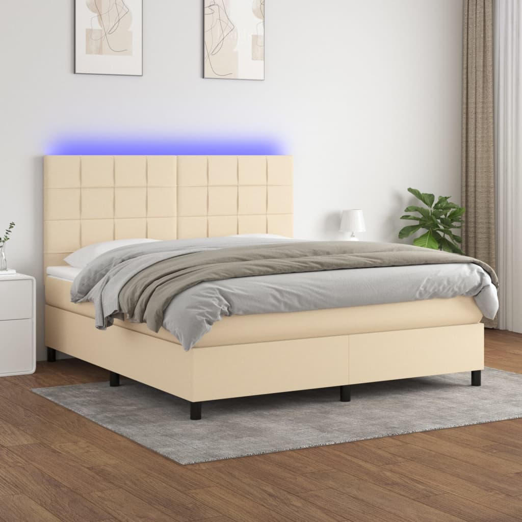 Box spring postel s matrací a LED krémová 180x200 cm textil