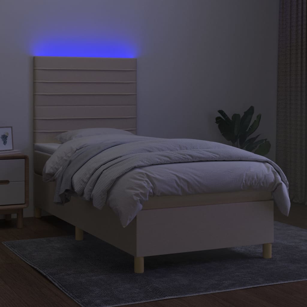 Box spring postel s matrací a LED krémová 90x200 cm textil