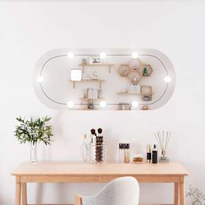 Stensko ogledalo z LED lučkami 25x60 cm stekleno ovalno