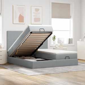 Otomanski posteljni okvir z vzmetnicami siv 180x200 cm blago